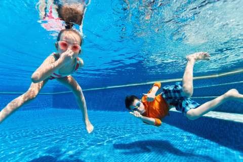 bigstock-Kids-having-fun-playing-underw-86974880